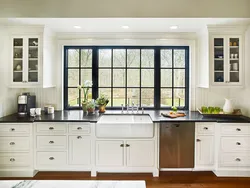 Window design in a white kitchen photo