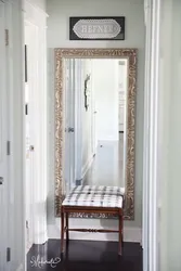 Photo of a mirror opposite the mirror in the hallway