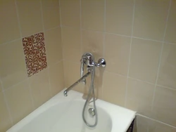 Faucet with tiles in the bathroom photo