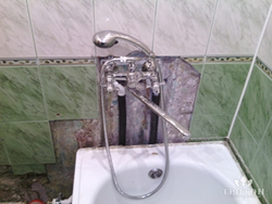 Faucet with tiles in the bathroom photo