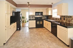 Light tiles in the kitchen interior photo