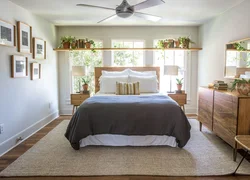 Photo Of A Bedroom With Flowers At The Headboard