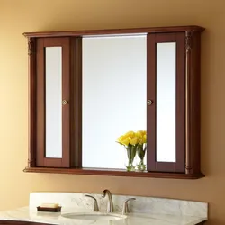 Wooden bathroom mirror photo