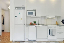 Refrigerator In The Interior Of A Bright Kitchen Photo