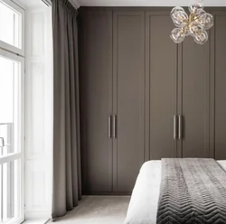 Gray and white wardrobe in the bedroom photo