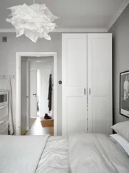 Gray and white wardrobe in the bedroom photo