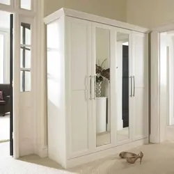 White hinged wardrobes in the hallway photo