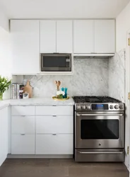 Kitchens with a cabinet above the stove photo