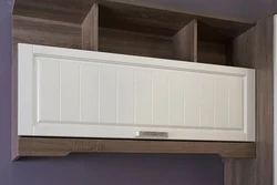 Photo of a kitchen shelf with doors