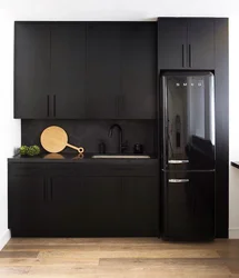 Gray kitchen with black refrigerator photo