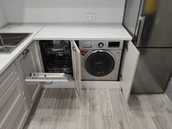 Black washing machine in the kitchen photo