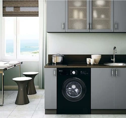 Black washing machine in the kitchen photo