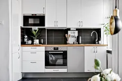 White kitchen with built-in hood photo