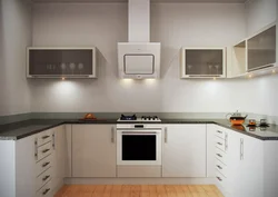 White kitchen with built-in hood photo