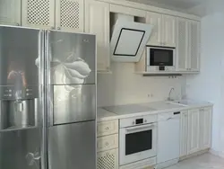 White kitchen with built-in hood photo