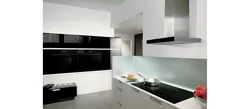 White kitchen with built-in hood photo