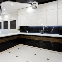 White Kitchen On Black Tiles Photo