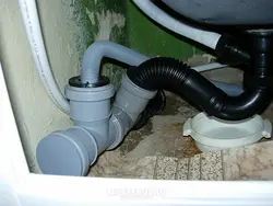 Washing machine draining into bathtub photo