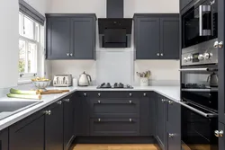 Black handles on kitchen facades photo