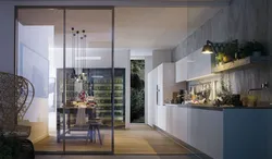 Living room and kitchen behind glass photo