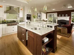 Photo Of A Kitchen With A Set In The Middle