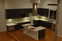 Photo Of A Kitchen With A Set In The Middle