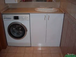 Washing machine with sink in the kitchen photo