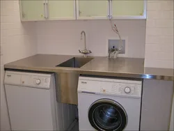 Washing machine with sink in the kitchen photo