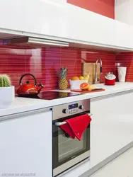 Gray kitchen with red apron photo