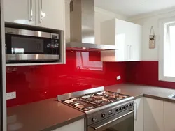 Gray kitchen with red apron photo