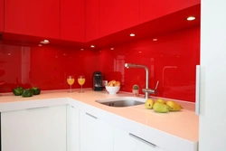 Gray Kitchen With Red Apron Photo