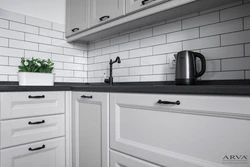 Kitchen With Black Handles And Brackets Photo