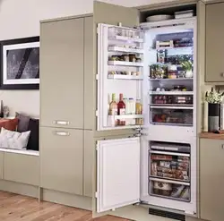 Холодильник в шкафу в гостиной фото