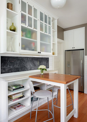 Cabinet above the table in the kitchen photo