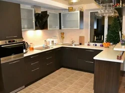 Black and brown kitchens in the interior photo