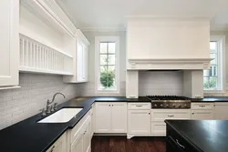 Light Kitchen With Black Apron Photo