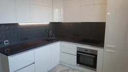 Light kitchen with black apron photo