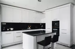 Light kitchen with black apron photo