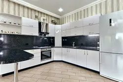 Light kitchen with black apron photo