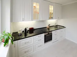 Light Kitchen With Black Apron Photo