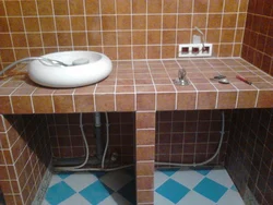 Bathroom cabinet made of tiles photo