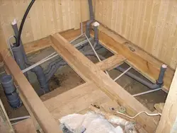 Extension of a bathtub to a wooden house photo