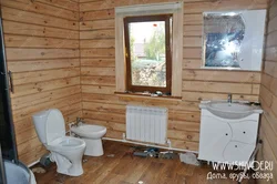 Extension of a bathtub to a wooden house photo