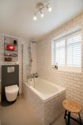 Photo of a bathroom with brick panels