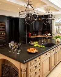 Black kitchen with brown countertop photo