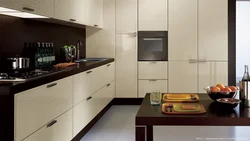 Black kitchen with brown countertop photo