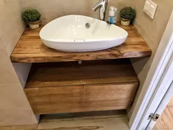 Wooden countertop in the bathroom photo design
