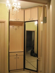 Wardrobe in the hallway with a mirror photo small-sized