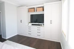 Chest of drawers and cabinets in one living room photo