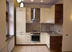 Kitchens on one side with a refrigerator photo